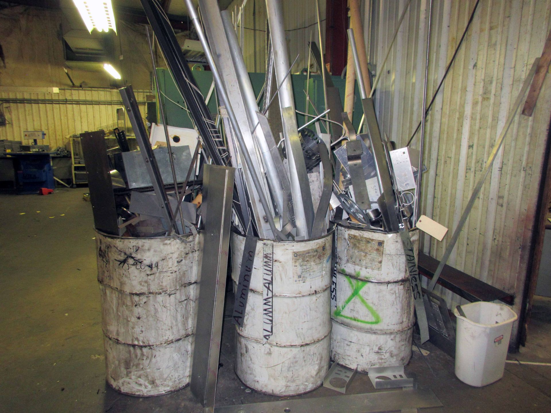 LOT OF OVERFLOWING SCRAP DRUMS: (1) stainless steel, (1) aluminum, (1) metal