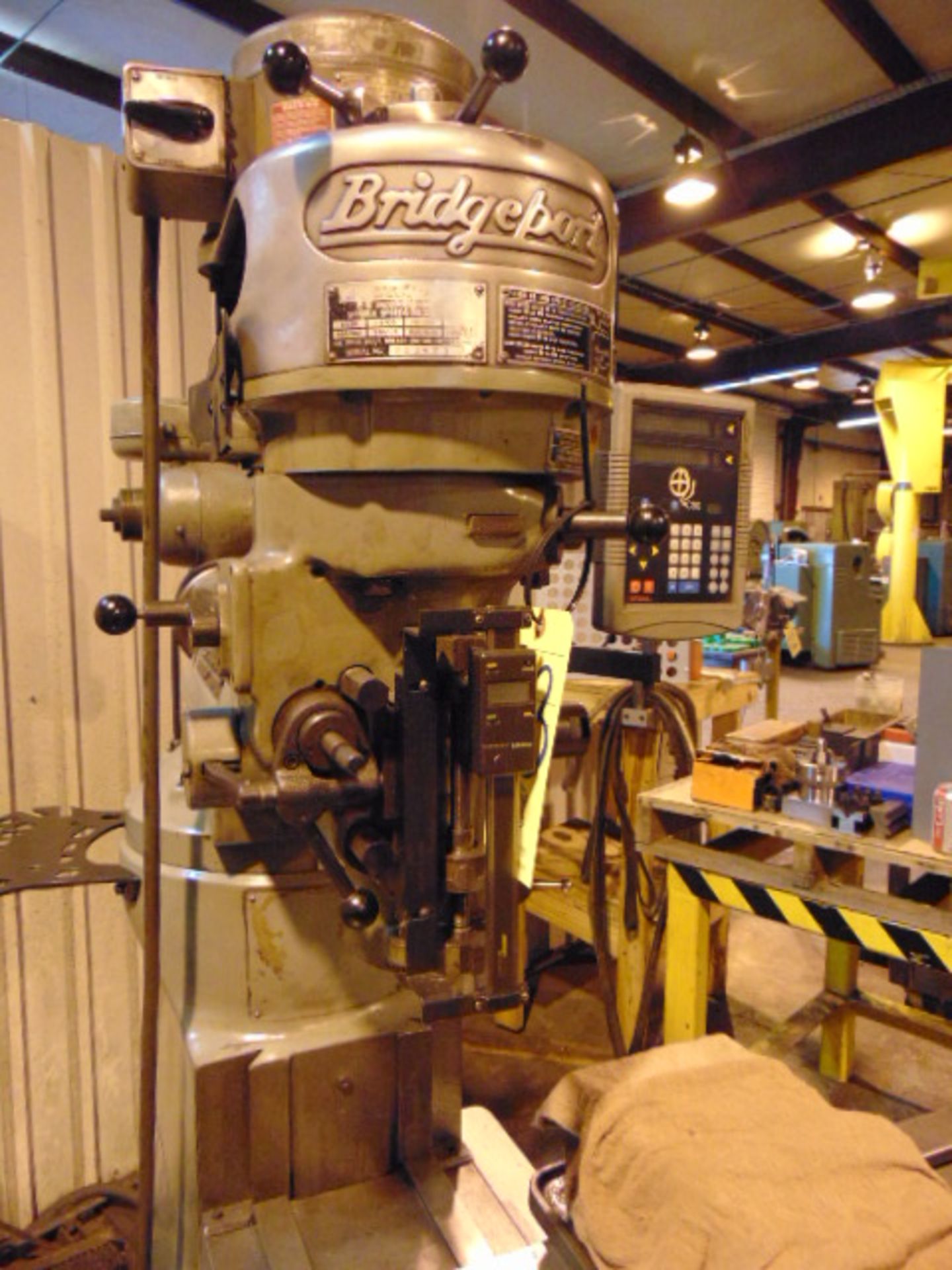 VERTICAL TURRET MILL, BRIDGEPORT J-HEAD, 9” x 42” table, 1 HP step pulley head, Newall 2-axis D.R. - Image 3 of 7