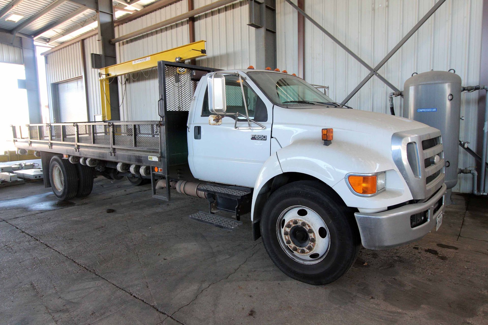 FLATBED TRUCK, 2007 FORD MDL. F650XL SUPER DUTY, auto. trans., approx. 20’L. bed, leather seats,