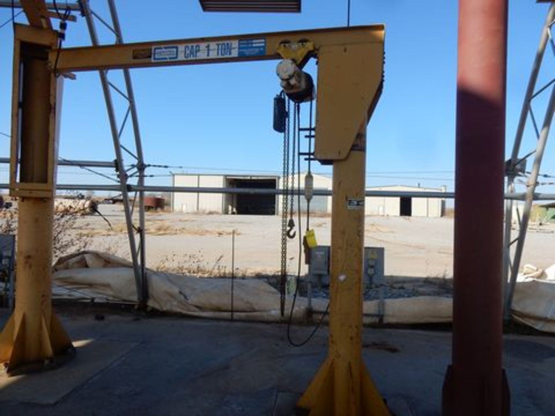 FLOOR MOUNTED JIB CRANE, CONTRX, 1 T. cap., 10' x 10', 1/2 T. electric chain hoist, 360 deg.