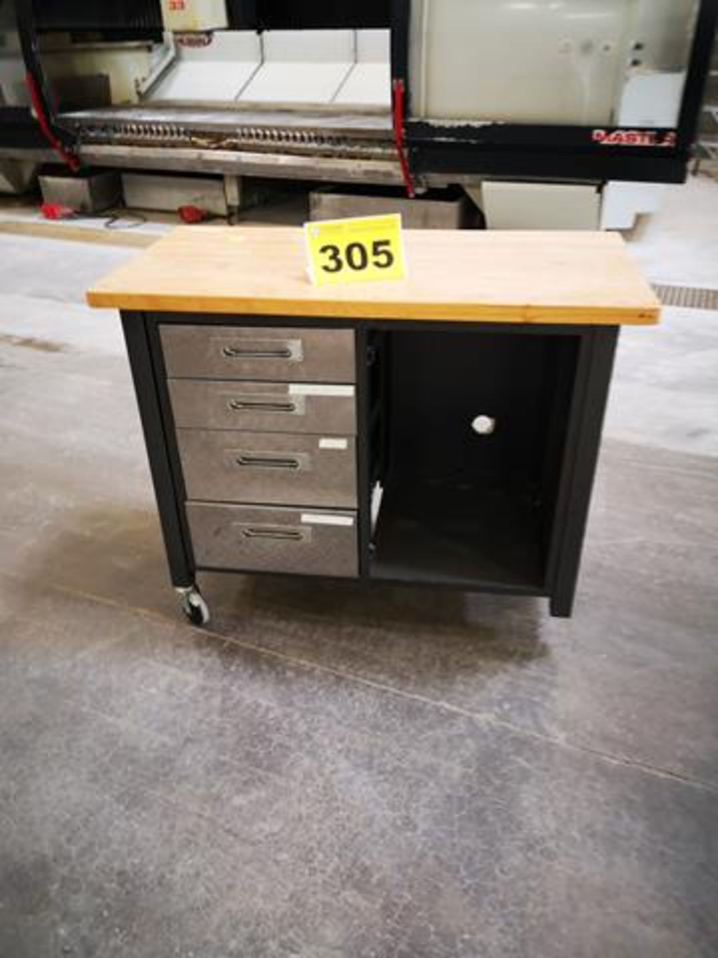 METAL WORKBENCH, WITH WOOD TOP AND 4 DRAWERS ON CASTERS