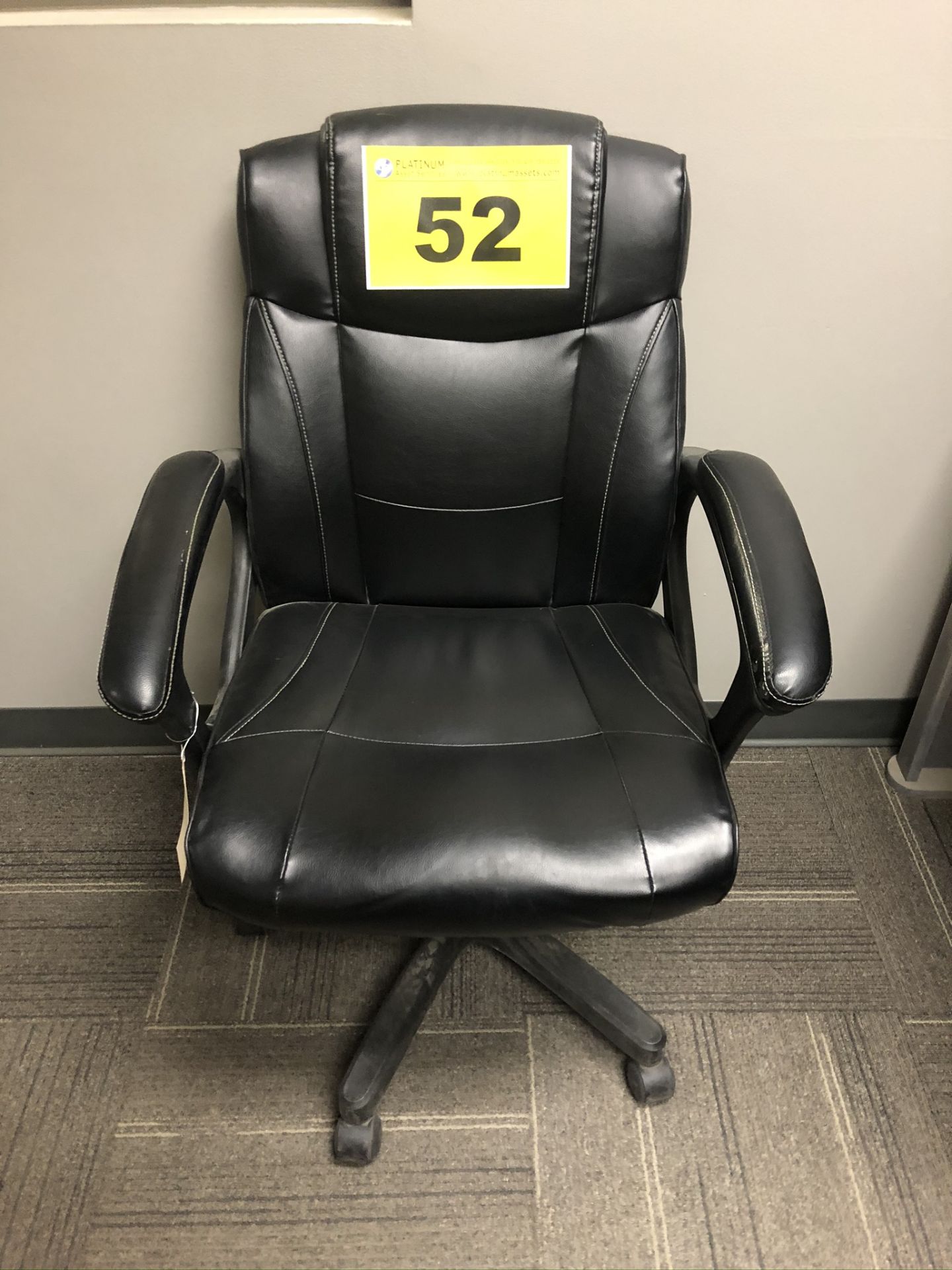 BLACK LEATHER EXECUTIVE CHAIR ON CASTERS