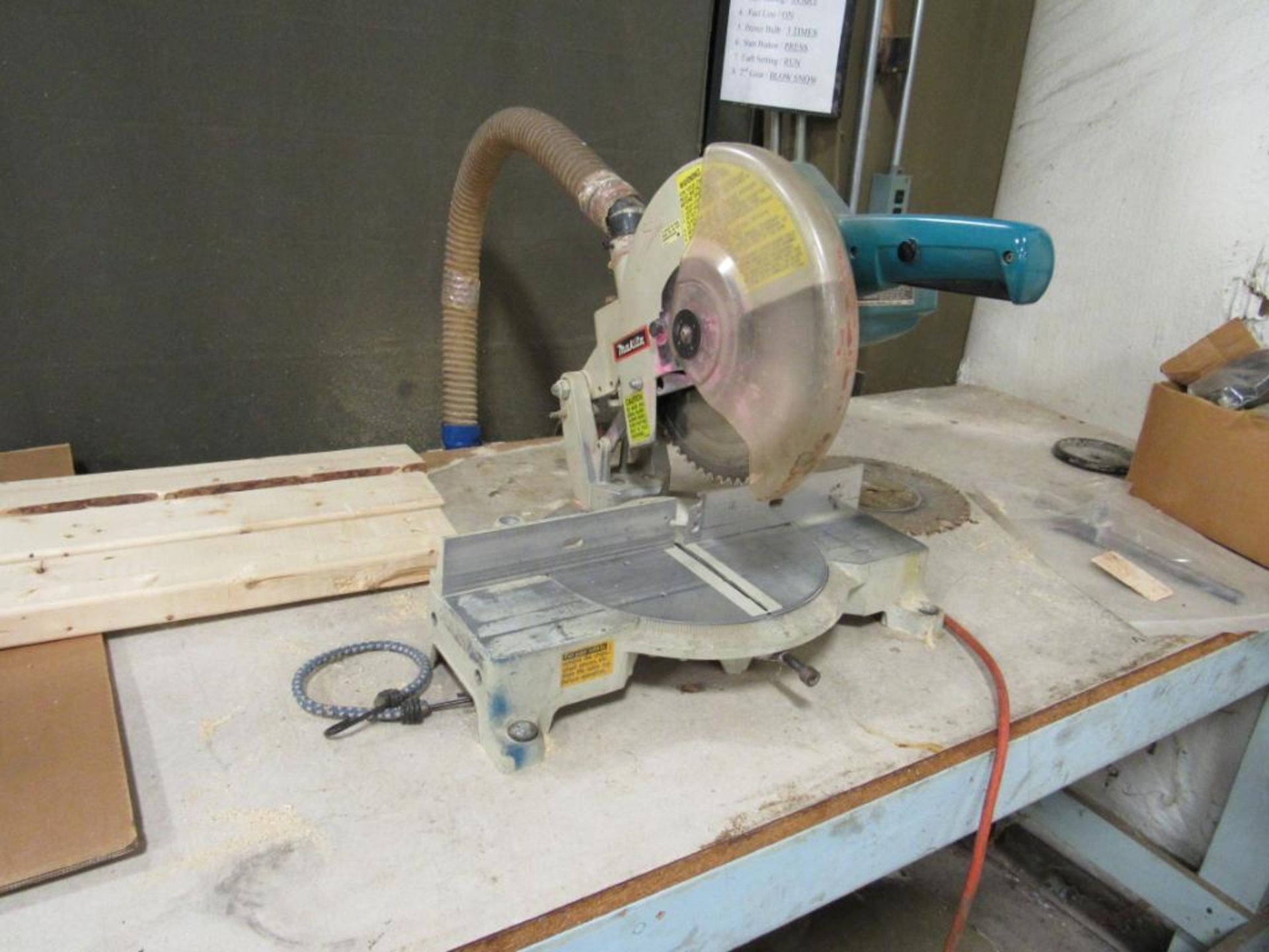 LOT: Makita 10 in. Miter Saw, with Wooden Work Bench & Shop Vac (Area C)