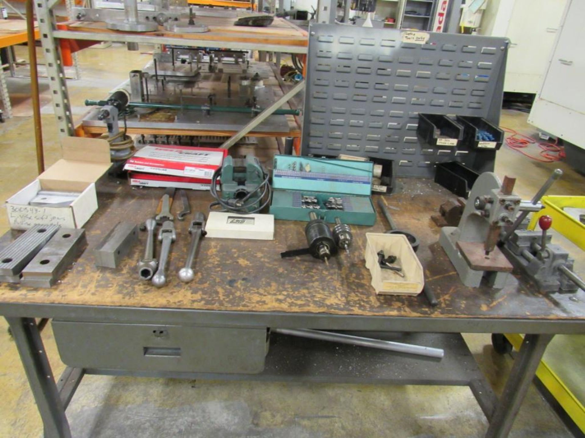 LOT: (1) 36 in. x 60 in. Steel Work Bench with Contents including (1) Small Arbor Press, Drill Vise,