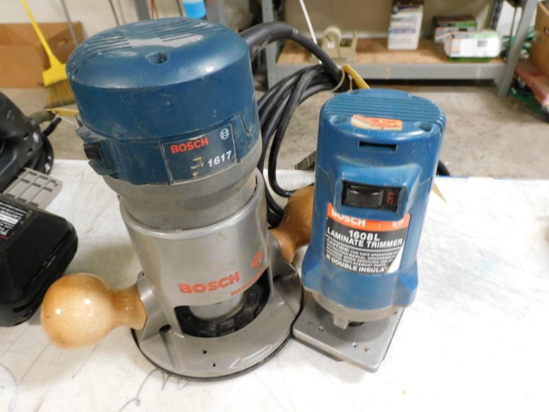 LOT: (1) Bosch 1617 Router, (1) Bosch 1608L Laminate Trimmer