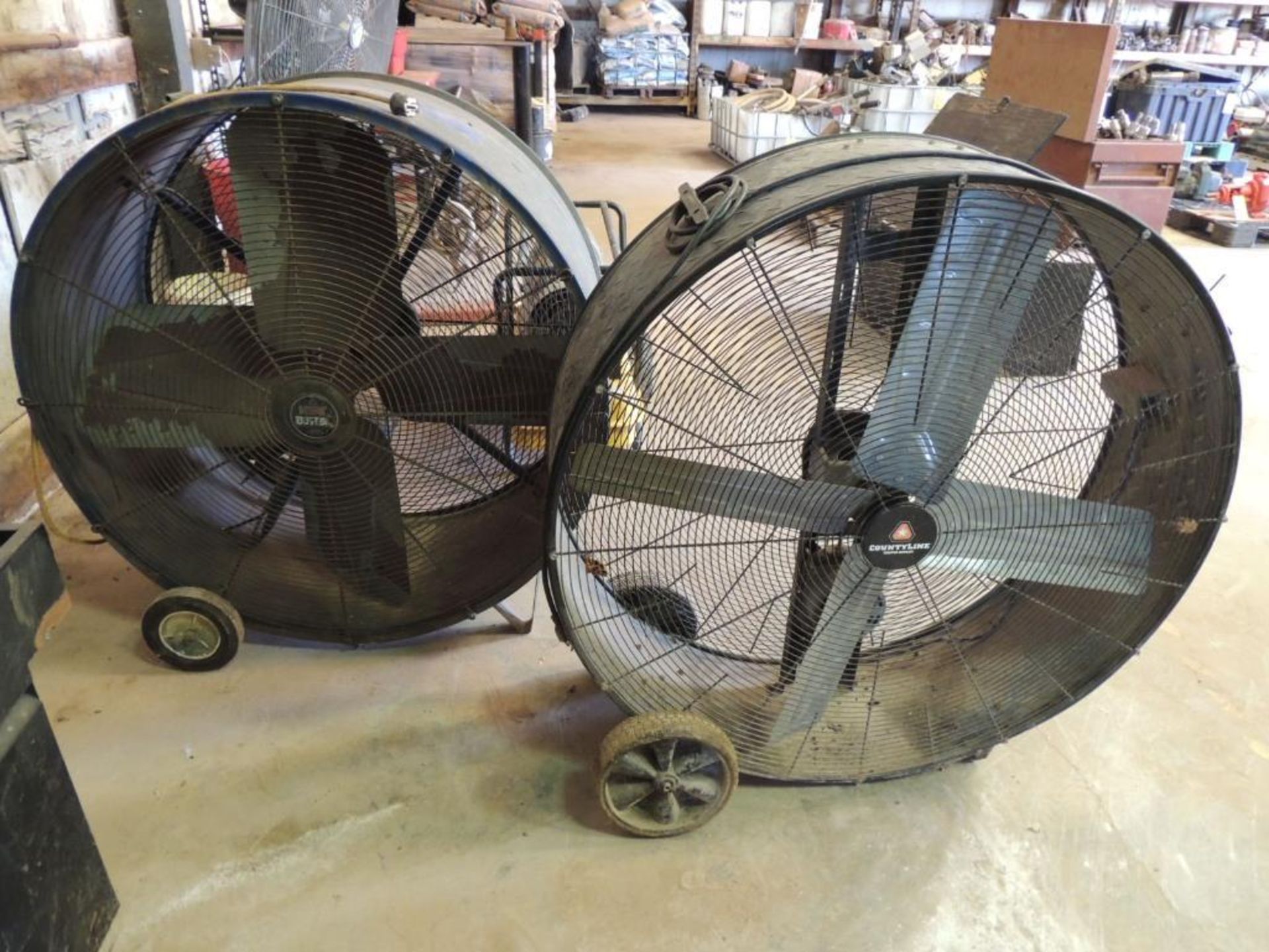 LOT: (1) Heat Buster 40 in. Barrel Fan, (1) County Line 40 in. Barrel Fan (LOCATED IN HENNESSEY, OK.