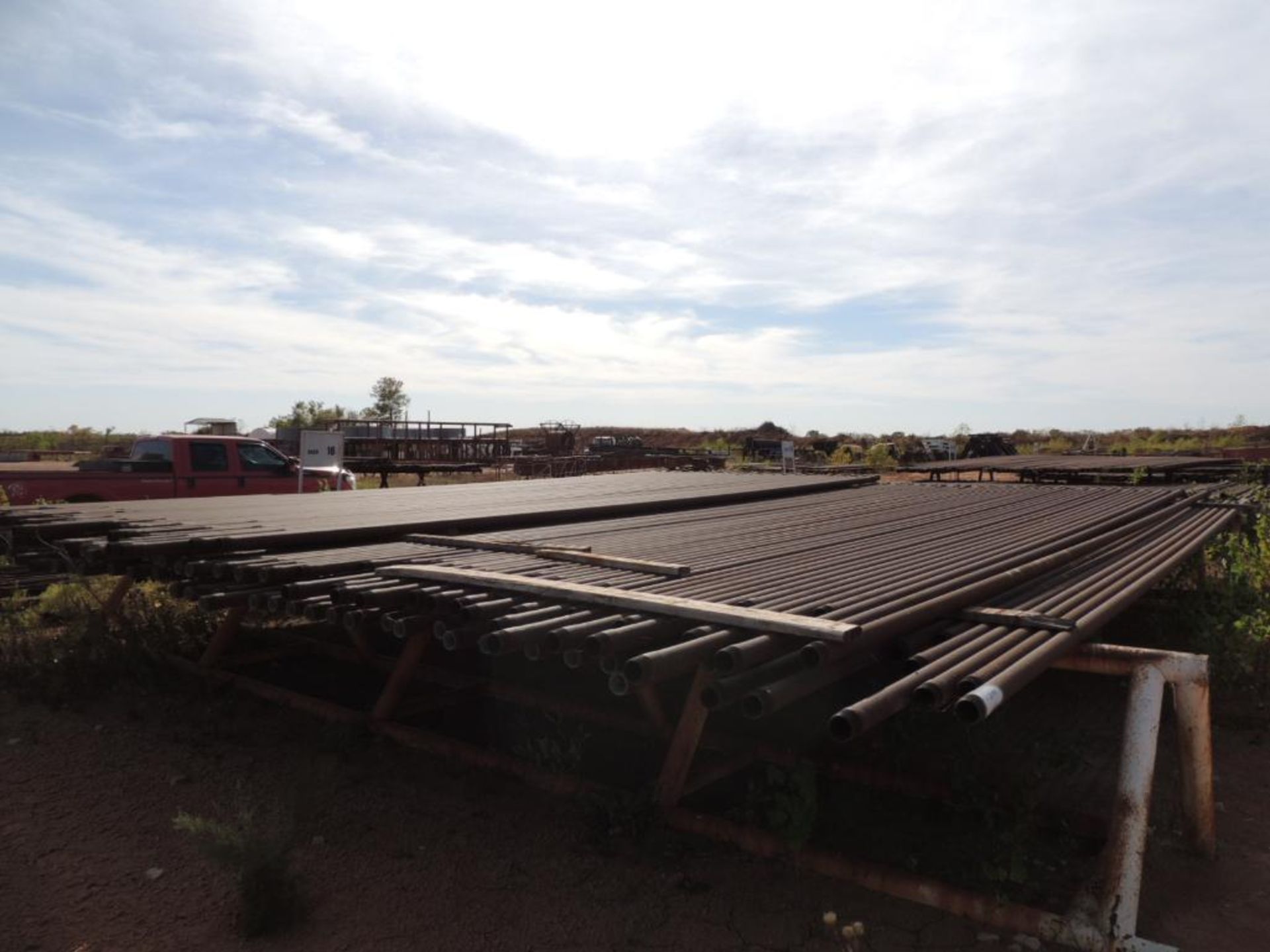 LOT: 2 7/8 In. Coated J55 Tubing, 2,100 ft. Estimated, Pipe Racks included (Located Lower Yard)(LOCA - Image 3 of 4