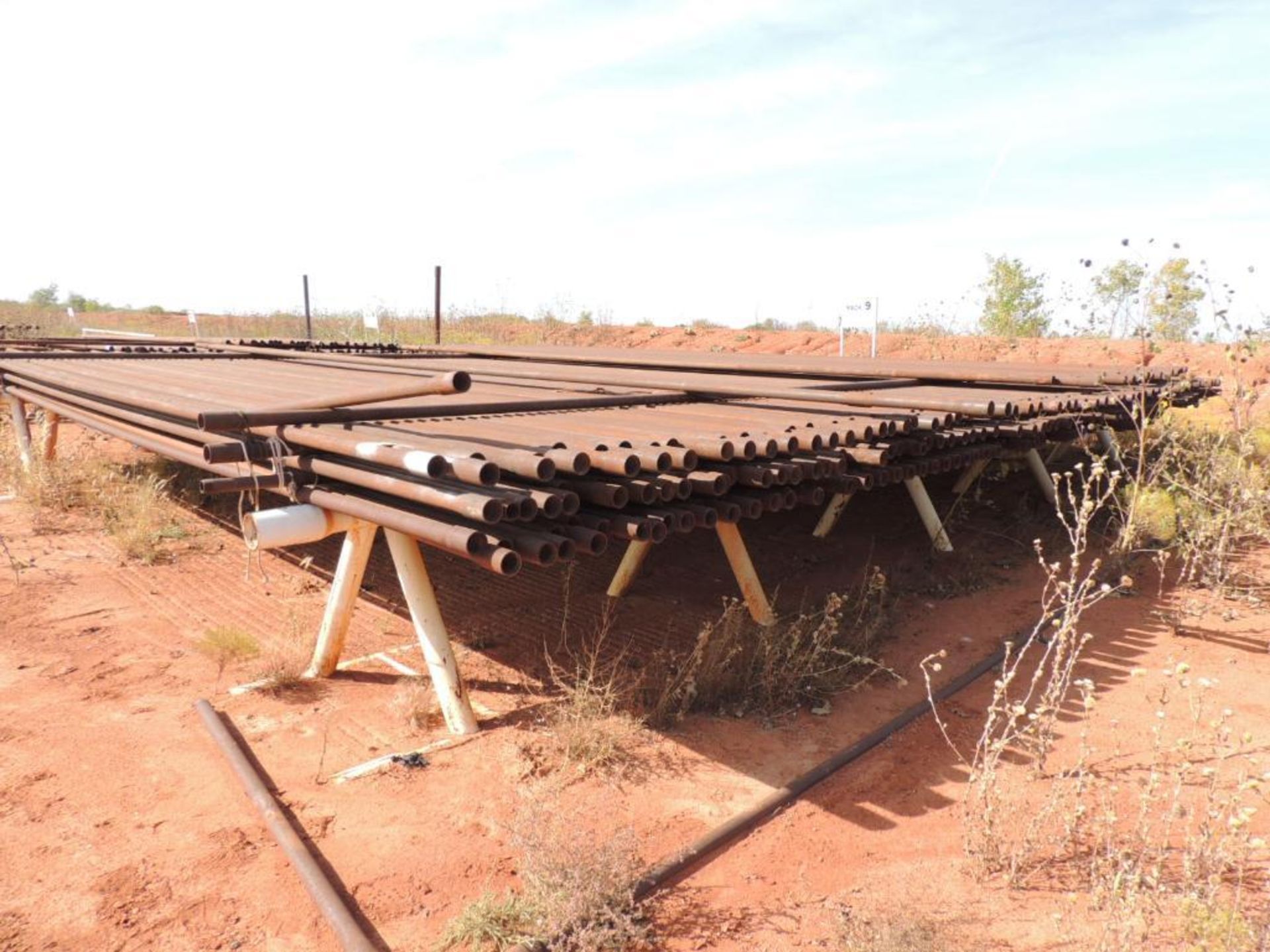 LOT: 2 3/8 In. J55 Tubing 12,000 Ft. Estimated, Pipe Racks included (Located Lower Yard)(LOCATED IN