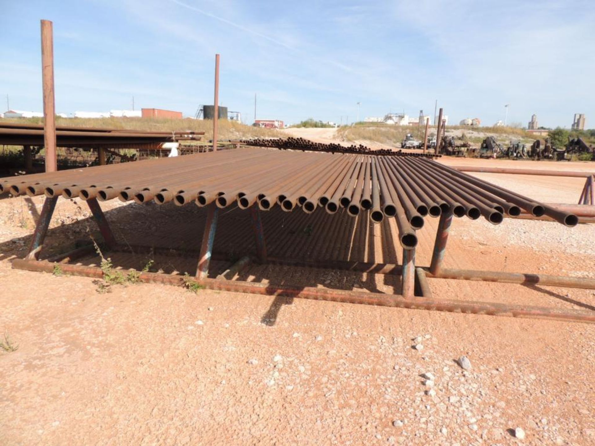 LOT: 2 7/8 In. Coated J55 Tubing, 1,600 ft. Estimated, Pipe Racks included (Located Lower Yard)(LOCA - Image 3 of 4