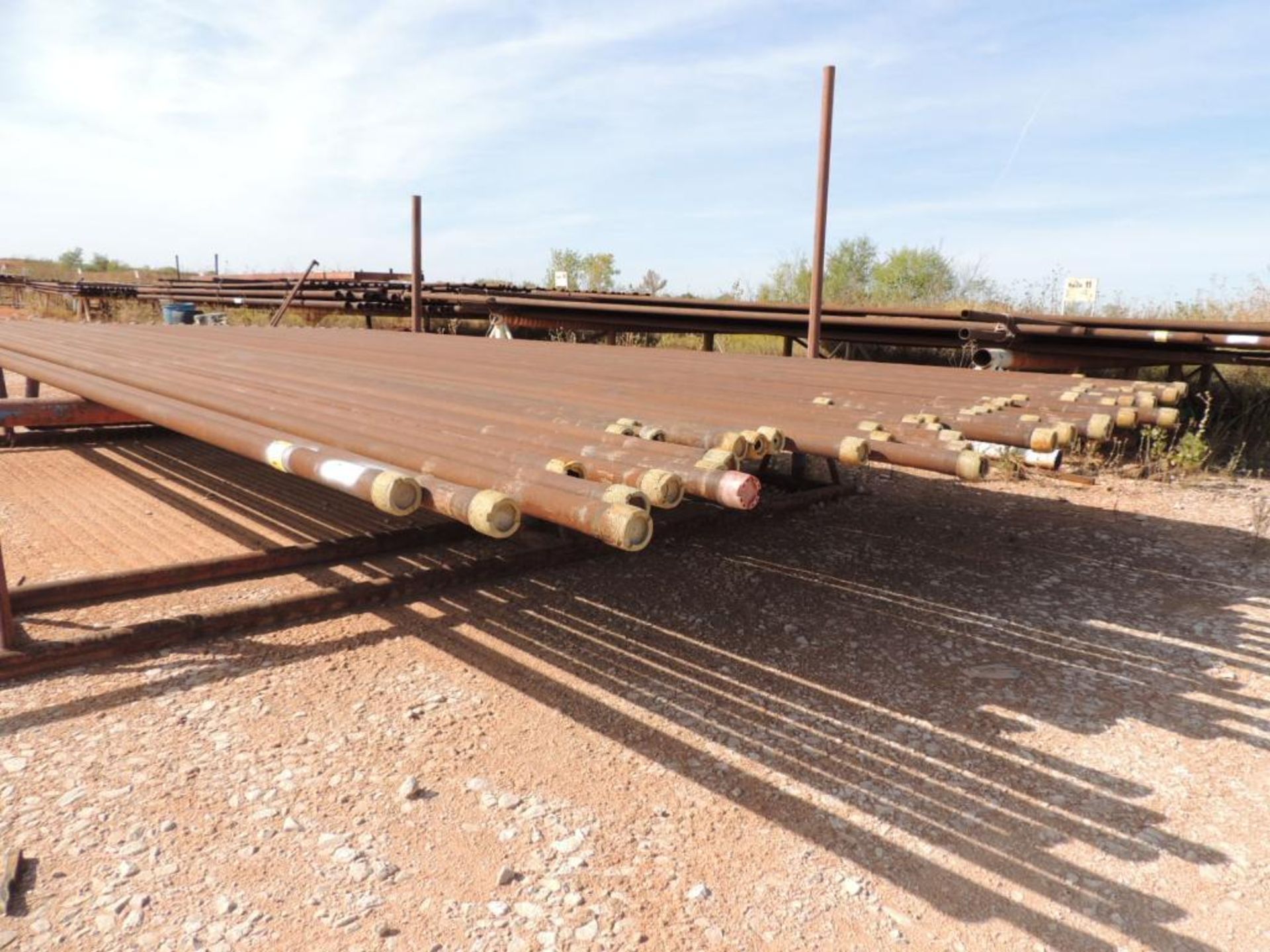 LOT: 2 7/8 In. Coated J55 Tubing, 1,600 ft. Estimated, Pipe Racks included (Located Lower Yard)(LOCA - Image 2 of 4