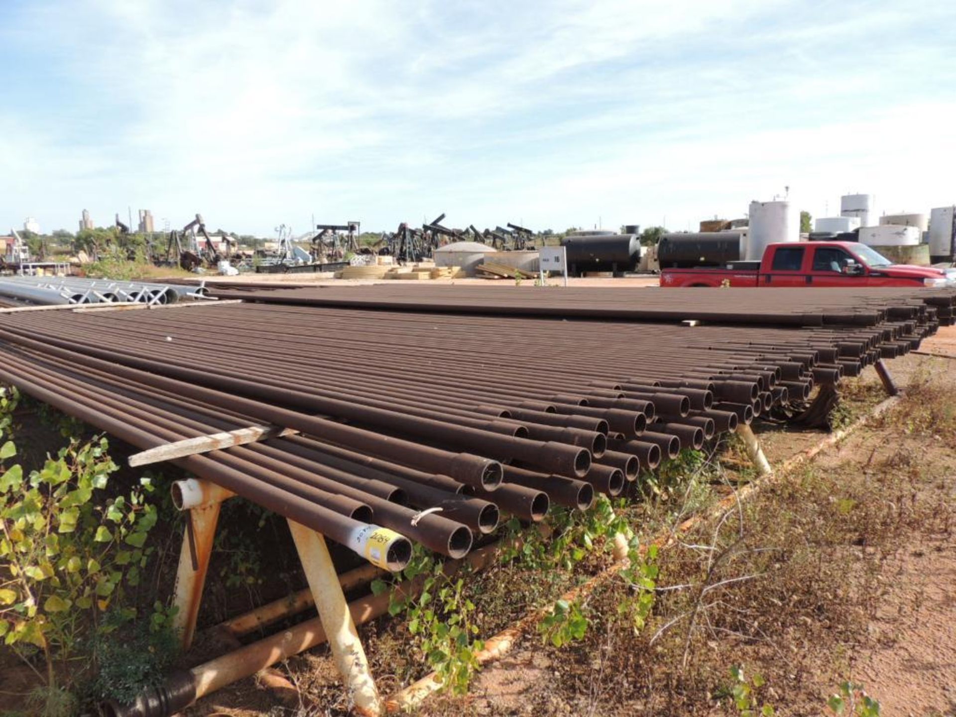 LOT: 2 7/8 In. Coated J55 Tubing, 2,100 ft. Estimated, Pipe Racks included (Located Lower Yard)(LOCA - Image 2 of 4