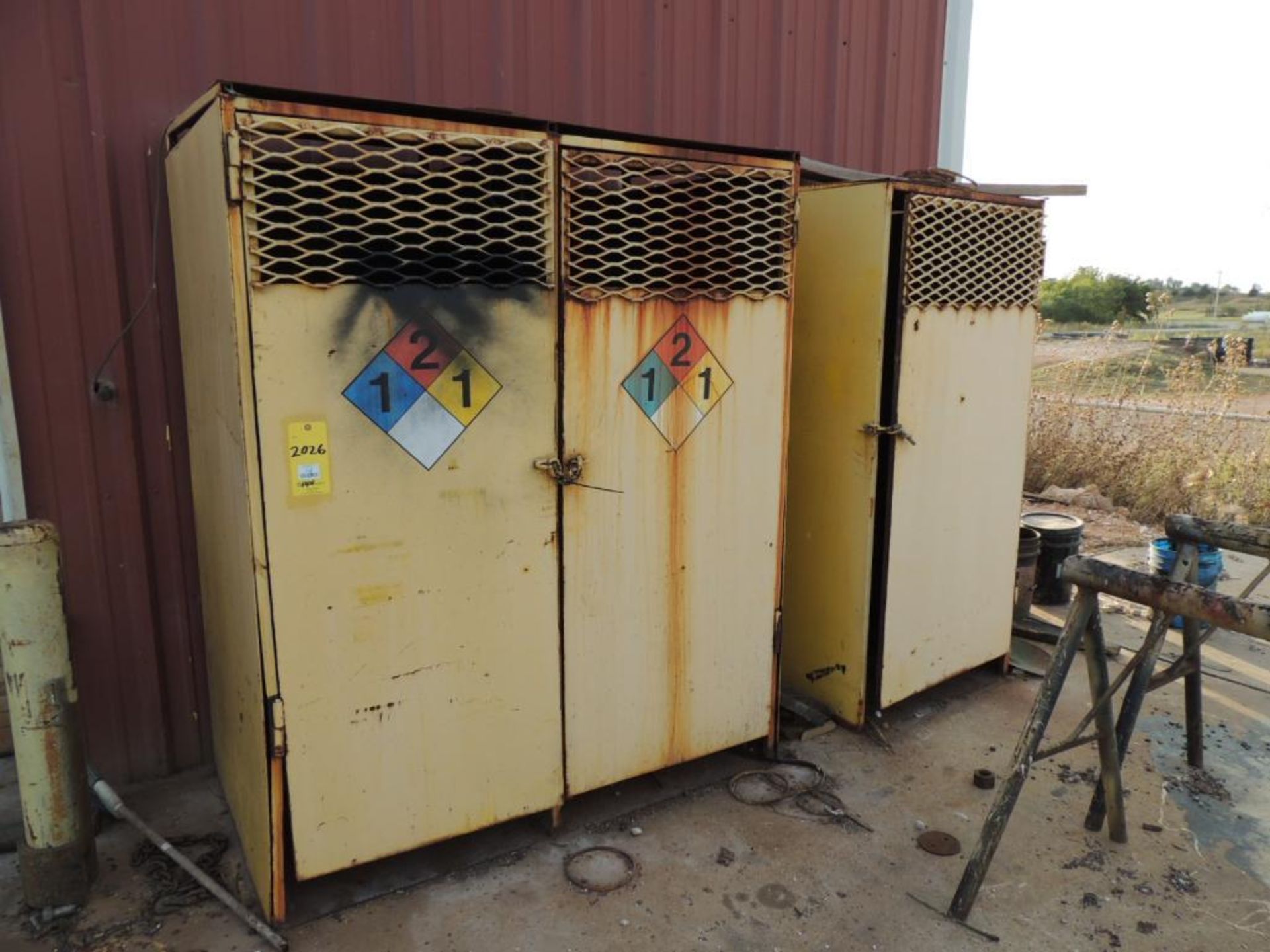 LOT: (2) Welding Gas Storage Compartments, (2) Steel Horses(Located Cowboy Bldg)(LOCATED IN HENNESSE