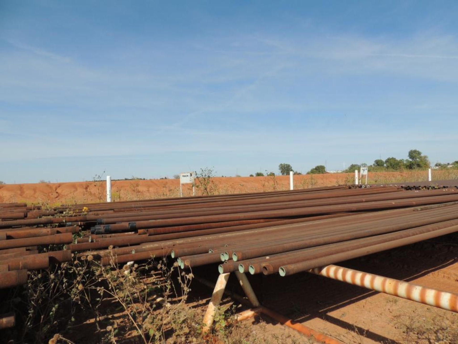 LOT: 2 7/8 In. Coated J55 Tubing, 6,000 ft. Estimated, Pipe Racks included (Located Lower Yard)(LOCA - Image 4 of 4