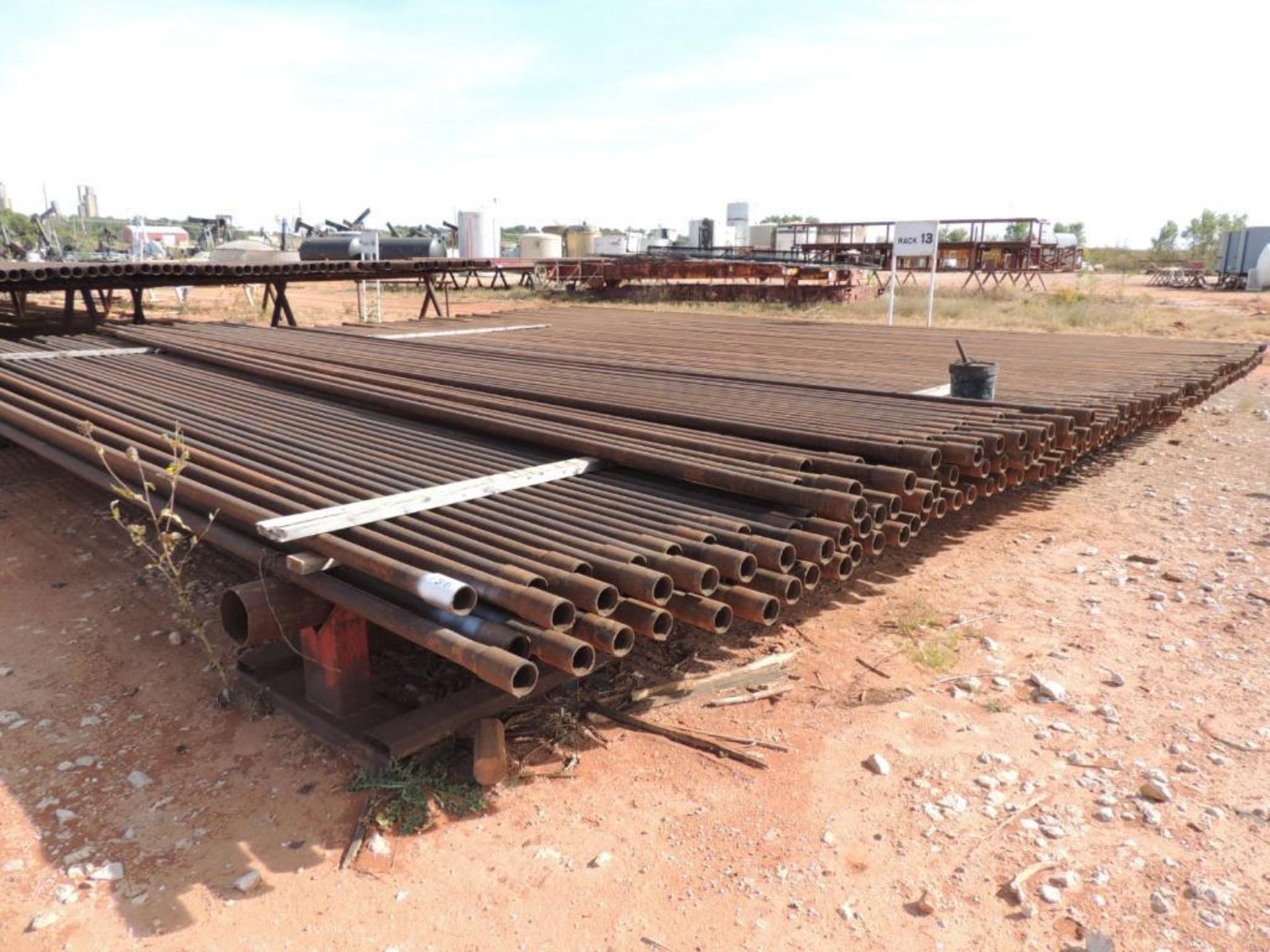 LOT: 2 3/8 In. J55 Tubing 7,800 Ft. Estimated, Pipe Racks included (Located Lower Yard)(LOCATED IN H - Image 5 of 8