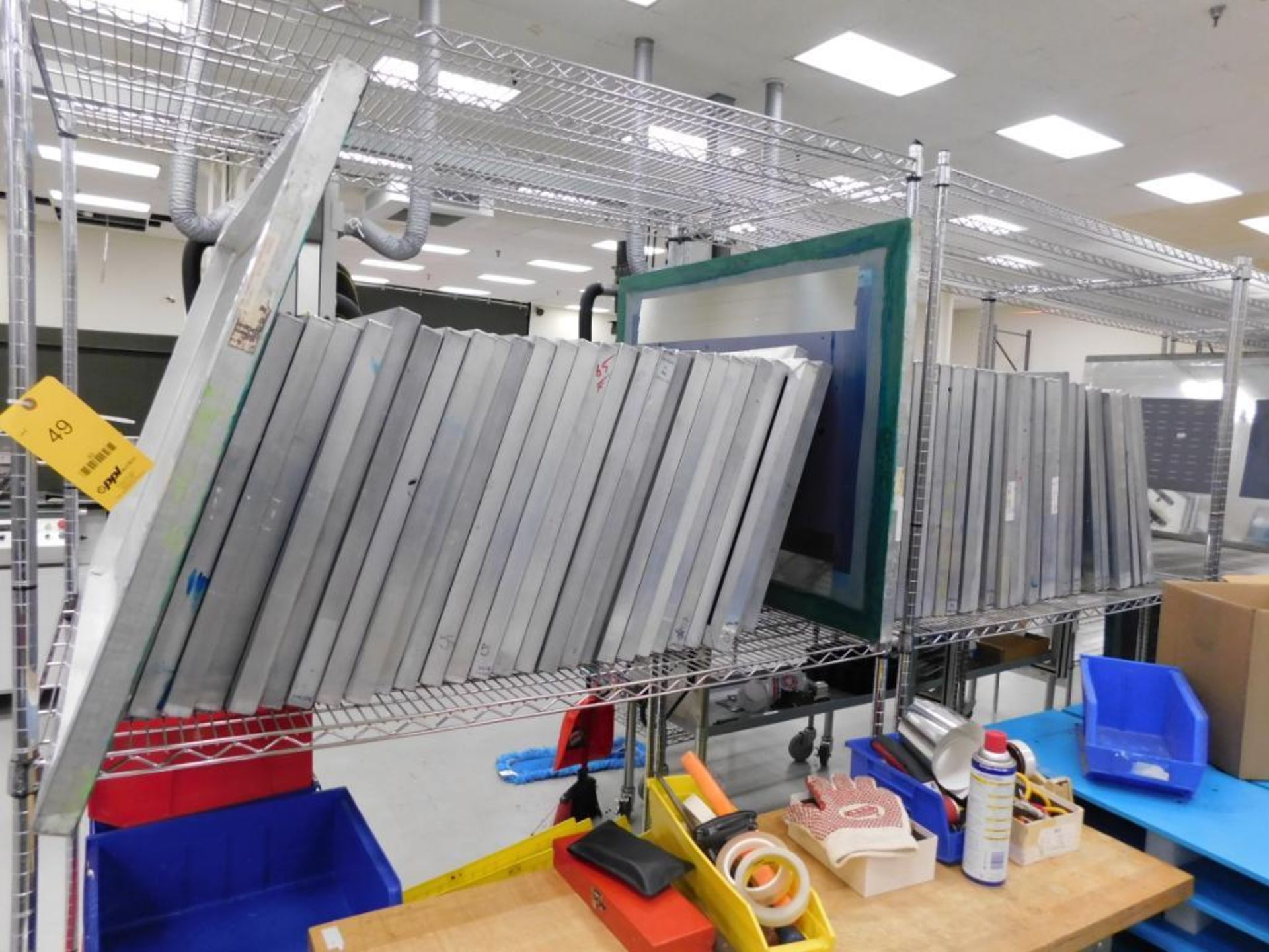 LOT: (65) 31 in. x 24 in. (mostly) Aluminum Silk Screen Frames, with (3) Metro Racks