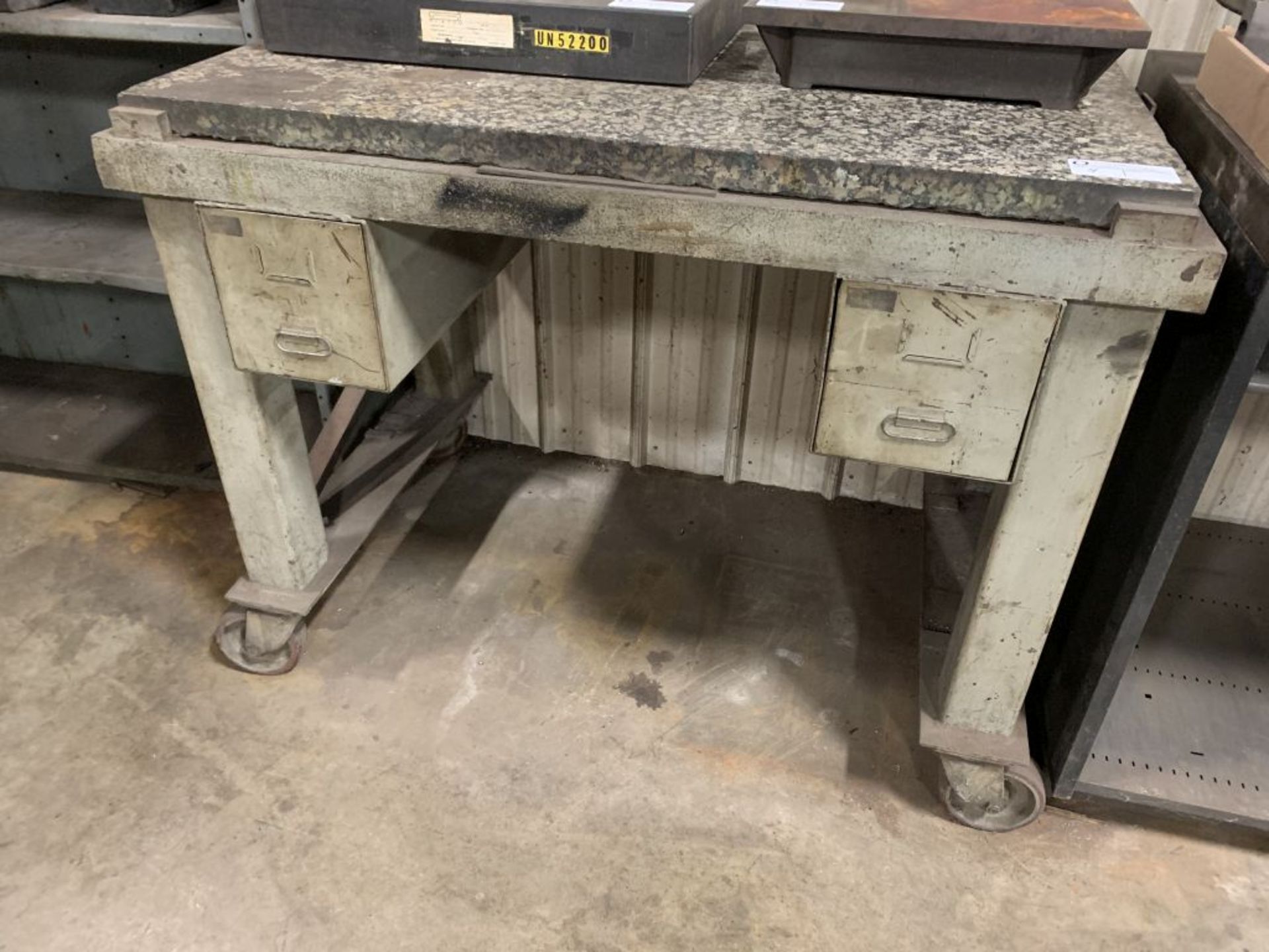 weld table with granite top and casters, 50" x 40" x 32"