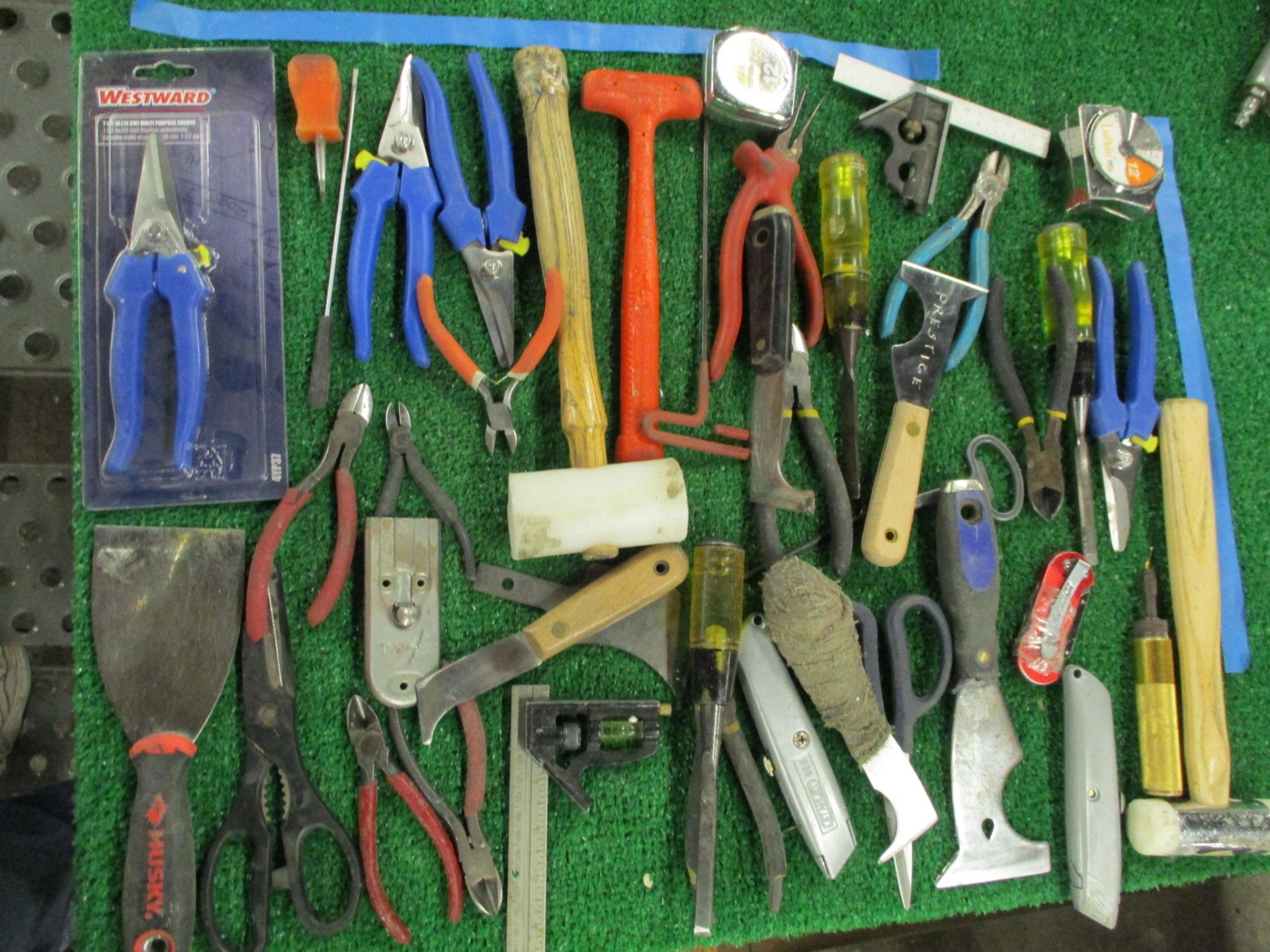 Assorted Hand Tools including Hammers, Screw Drivers, Putty Knives, Utility Knives, Pliers, Snips, T