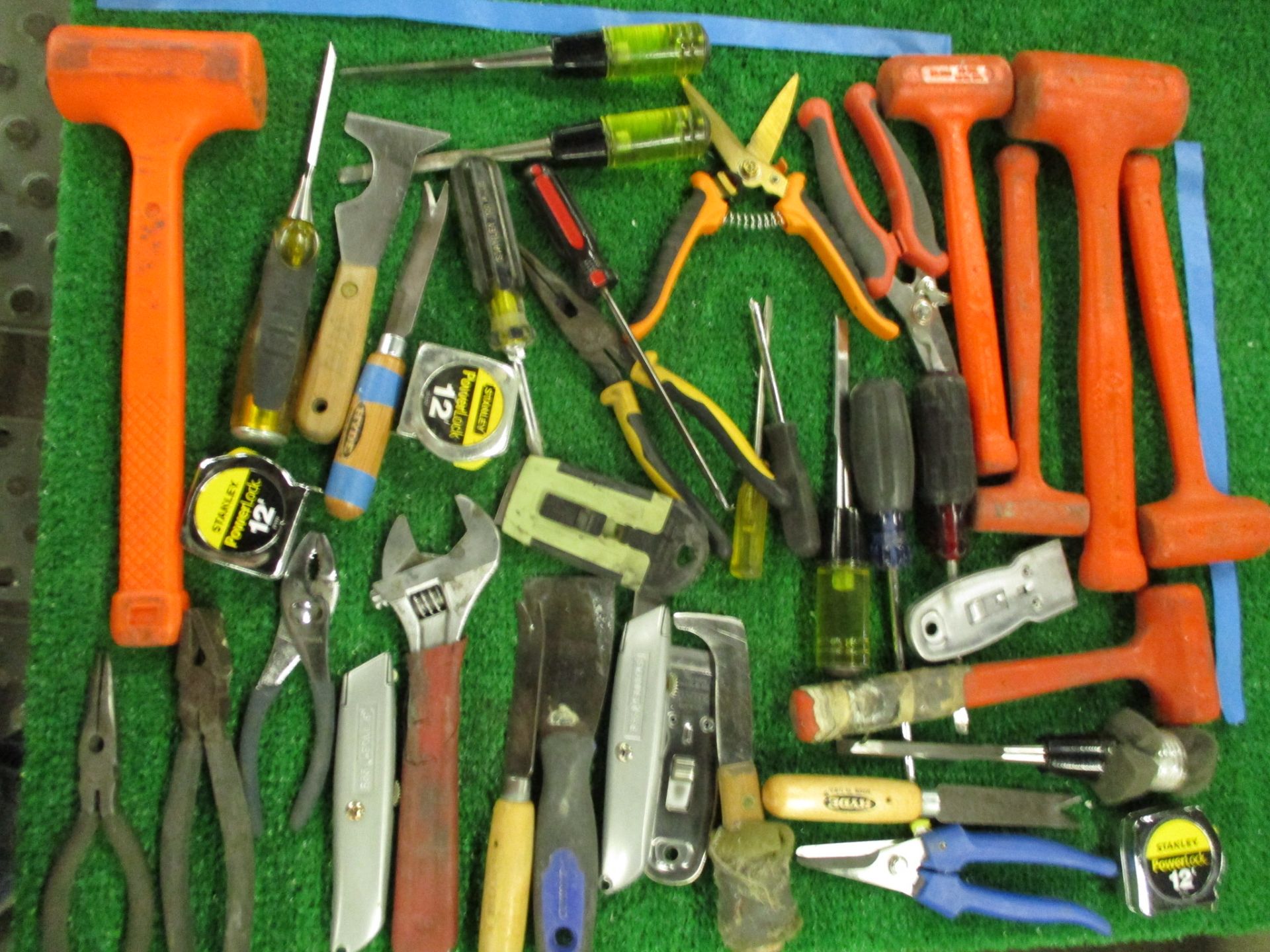 Assorted Hand Tools including Hammers, Screw Drivers, Putty Knives, Utility Knives, Pliers, Snips, T