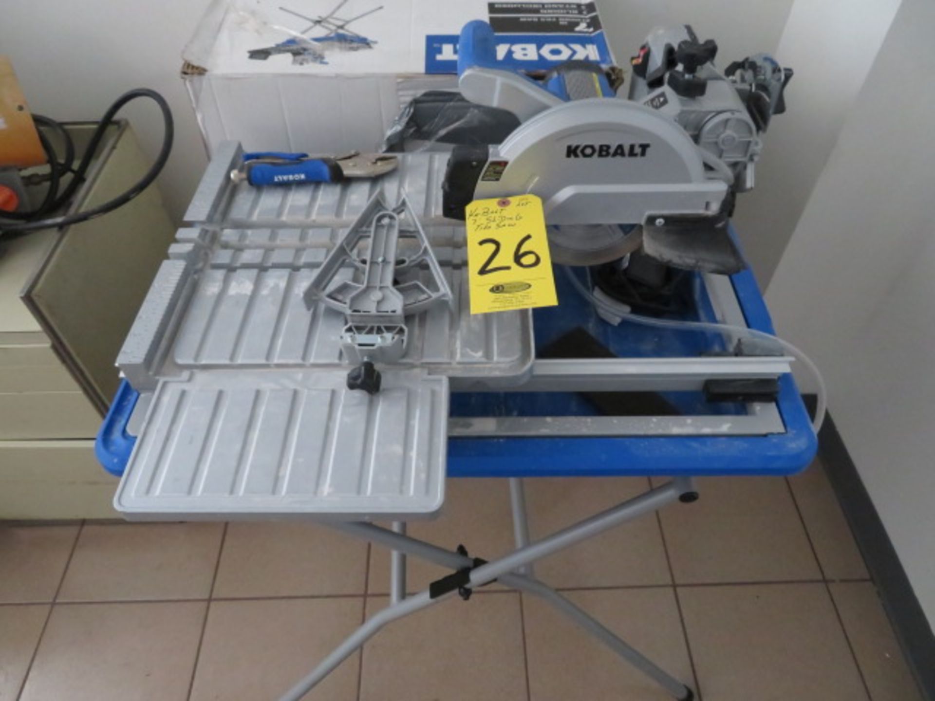 KOBALT 7 IN. SLIDING TABLE TOP WET TILE SAW W/STAND( SHOWS LITTLE USE)