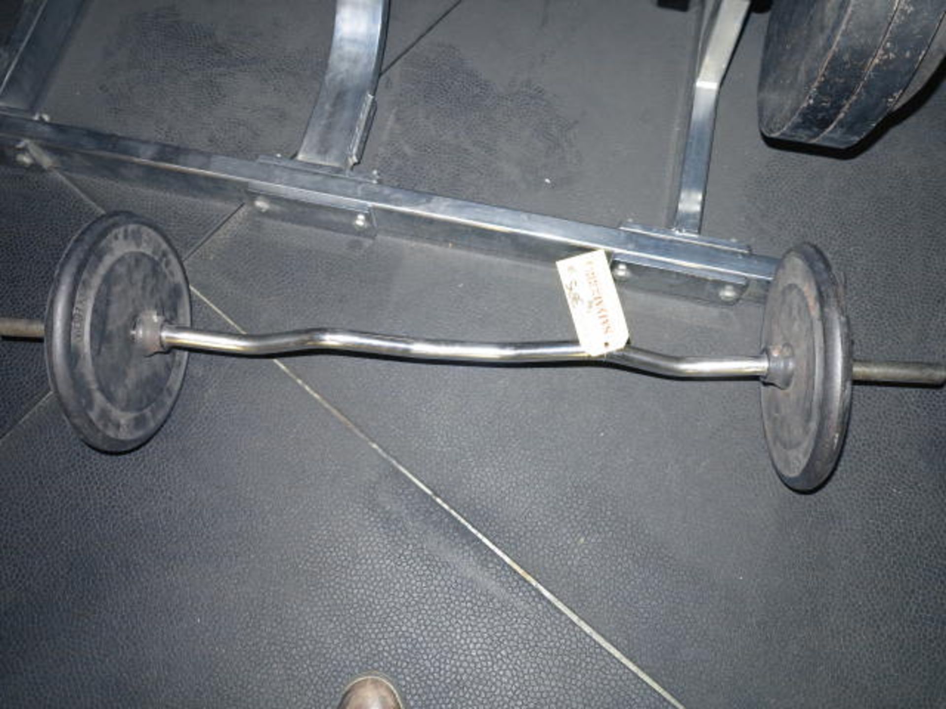 Curl Bar & Weights Located on Mezzanine
