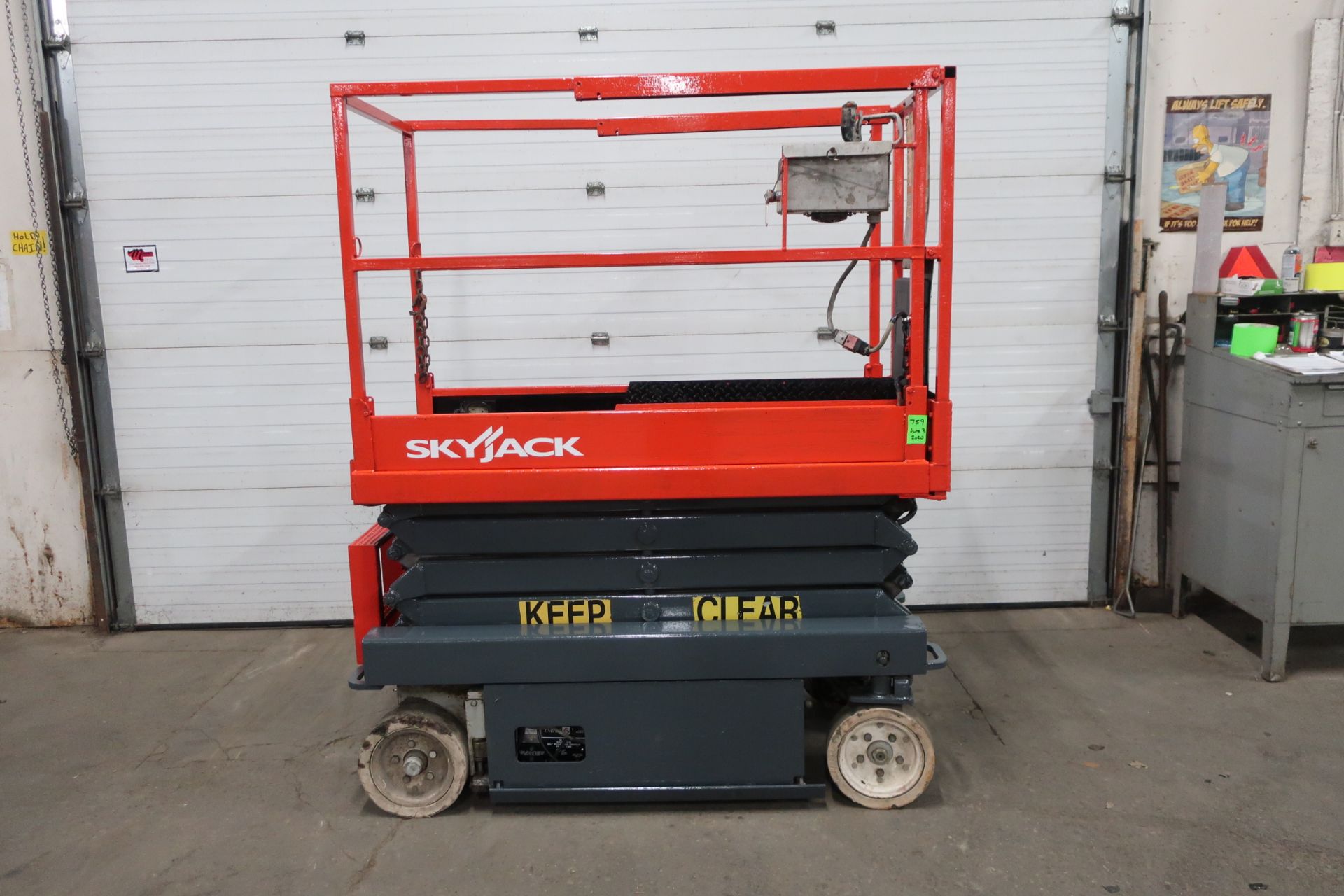 SkyJack Electric Scissor Lift model 3219 - 19 feet lift, 32 inch width deck with pendant controller