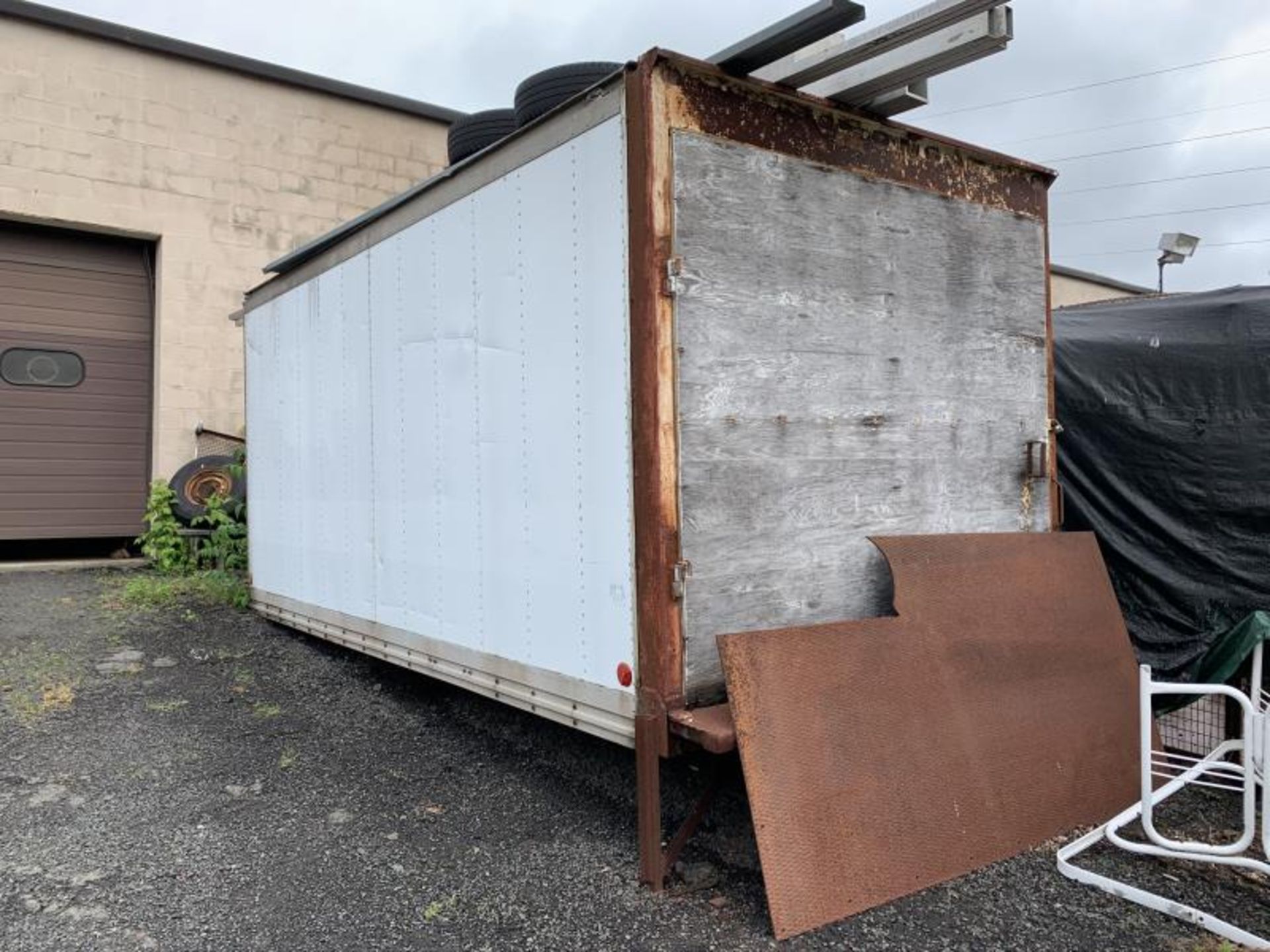 Aluminum storage box with contents, 8'x16'. Tubing and item on top of box not included.