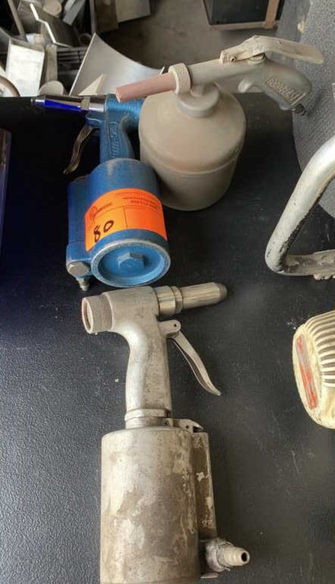 Pneumatic paint guns