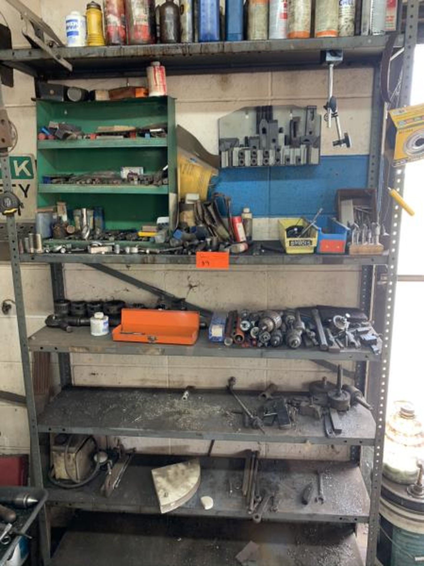 Metal Shelf with misc chucks, cutters, pipe threaders, tap, die tools