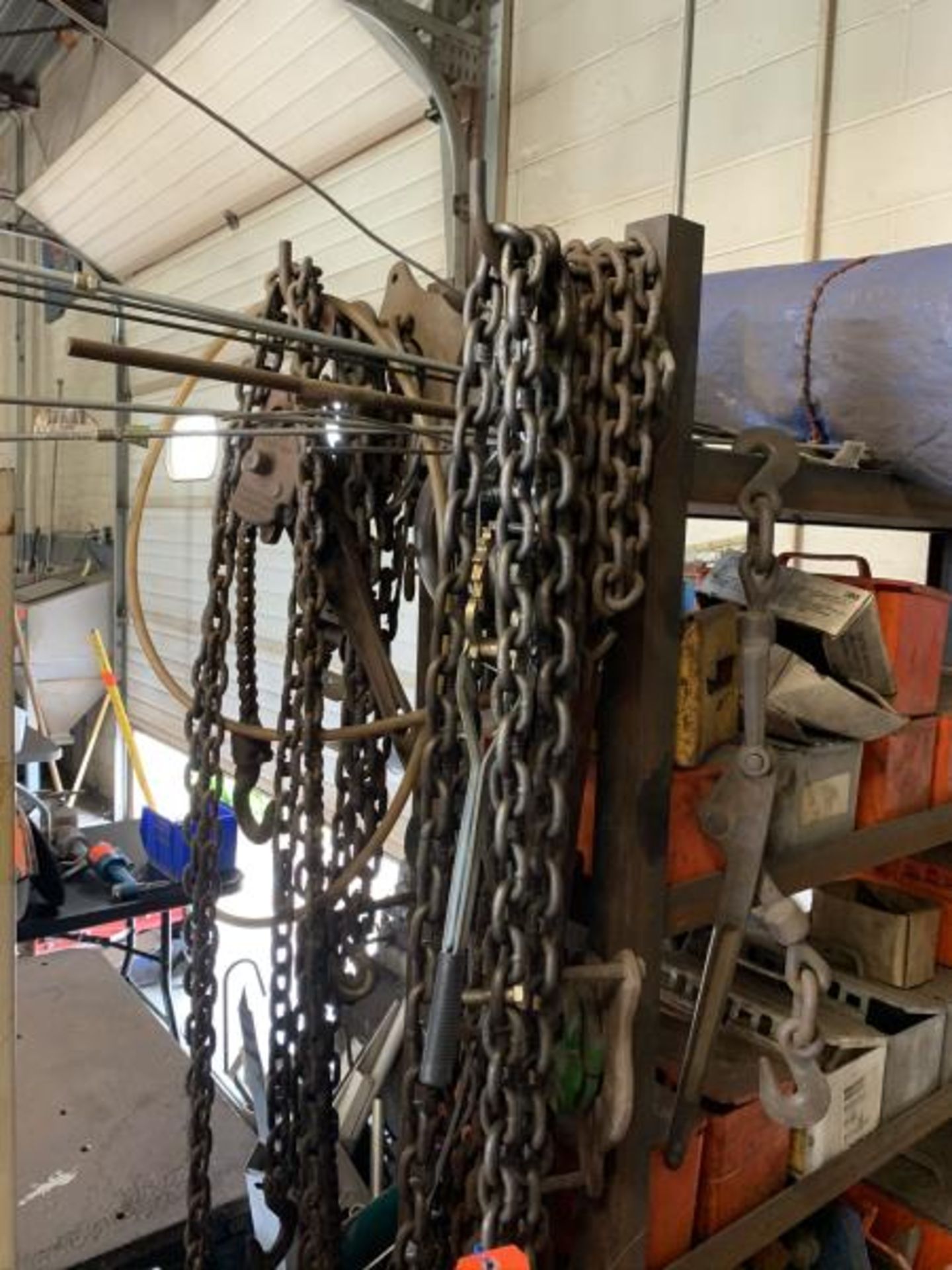 Lot of chains, come-a-long, cafing hoist