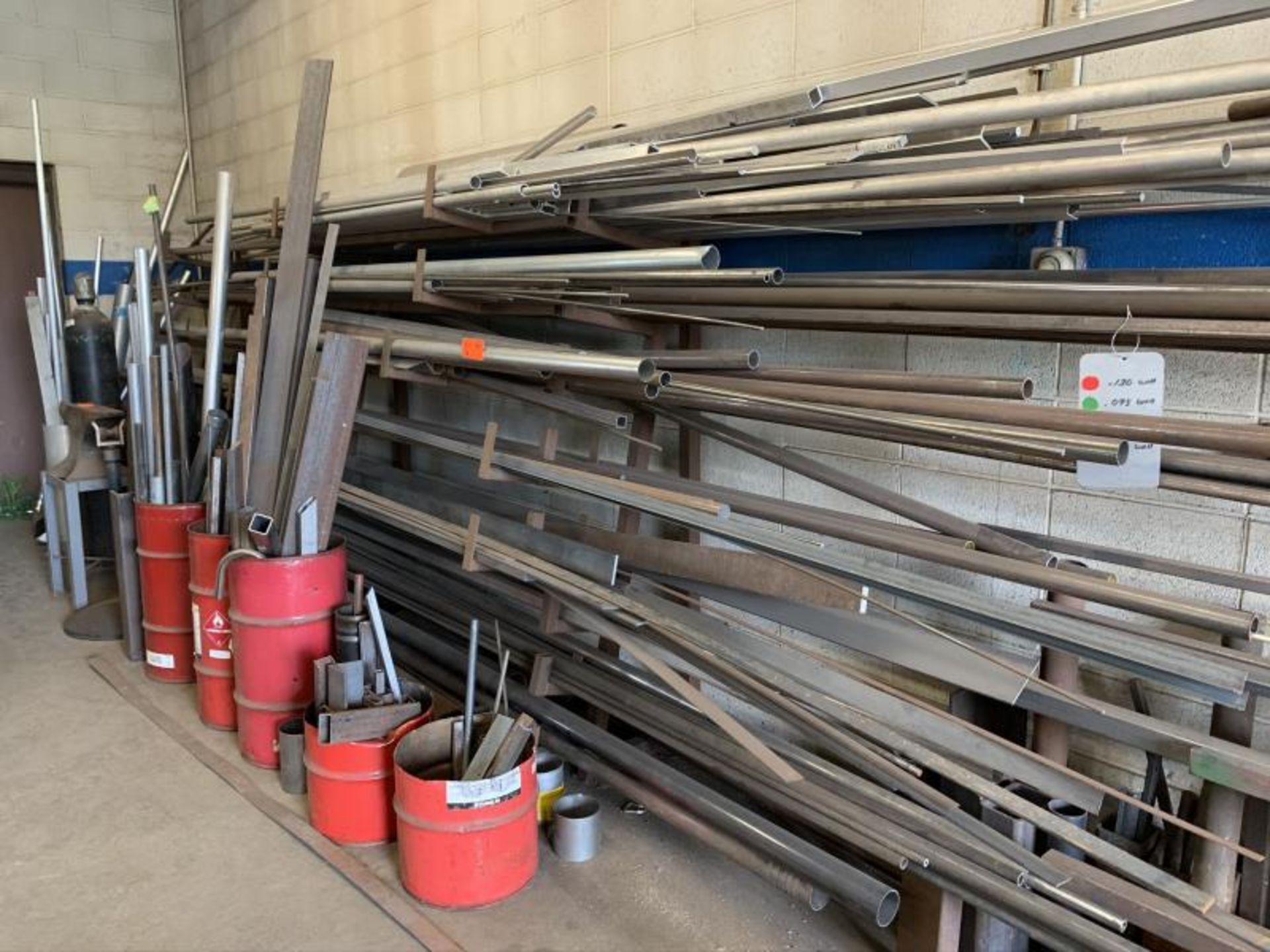 Eight tier cantalever metal stock rack, contents of steel & Alumium inventory with (5) red piles