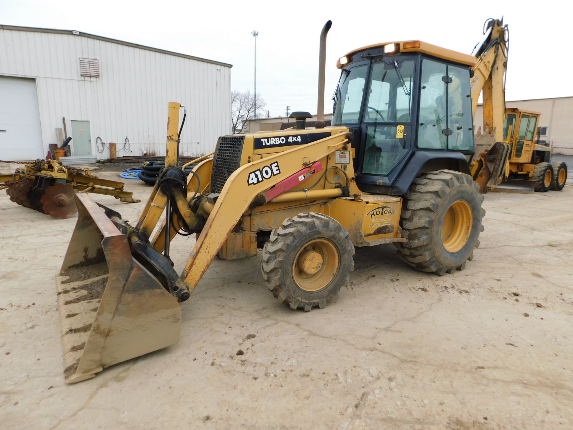 2000 John Deere Model 410E Backhoe, Turbo 4 x 4, Enclosed Cab, 7'6" Loader Bucket, 24" Backhoe