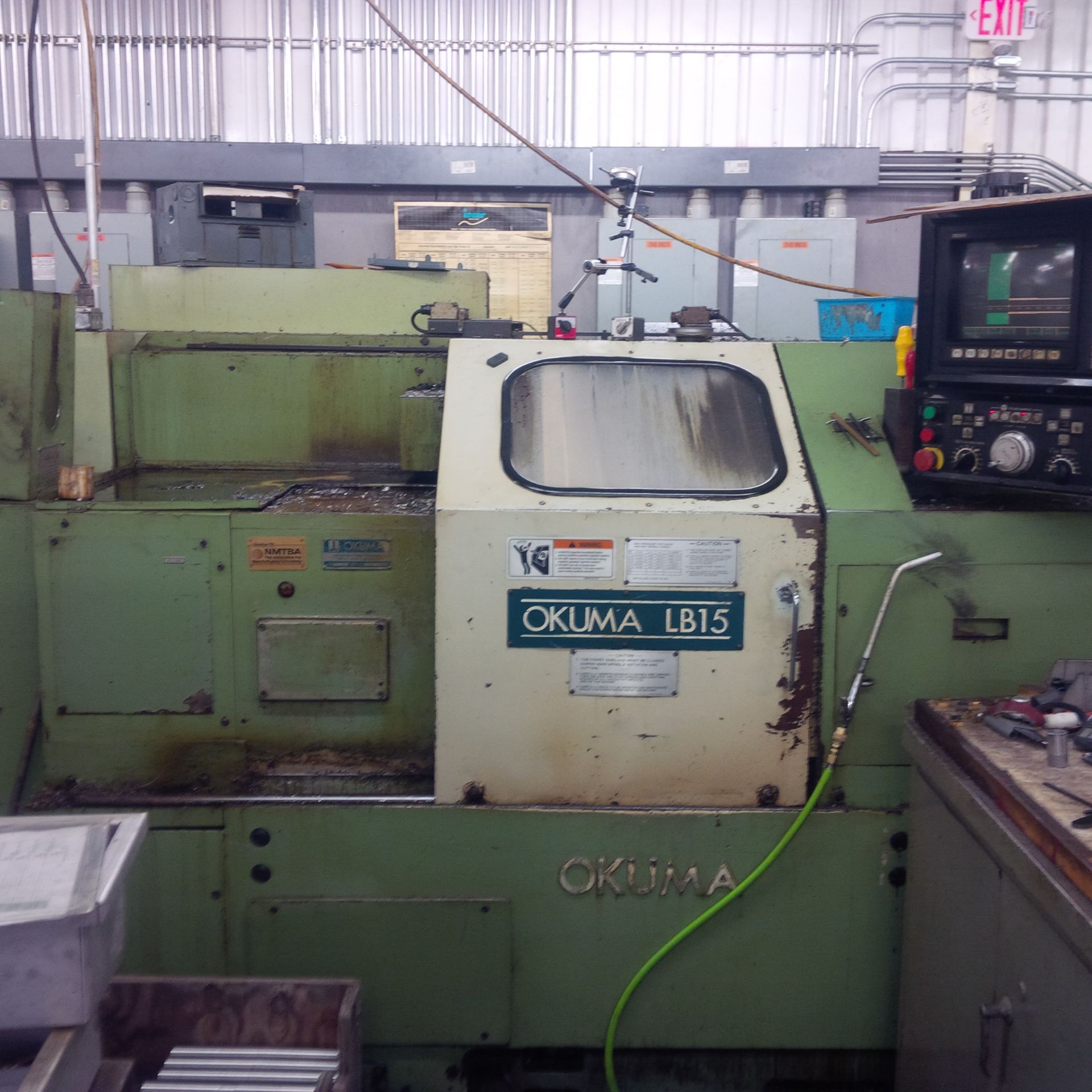 Okuma LB-15 CNC Turning Center, s/n 9986, OSP-5020L CNC Control, 10" 3-Jaw Chuck, Chip Conveyor