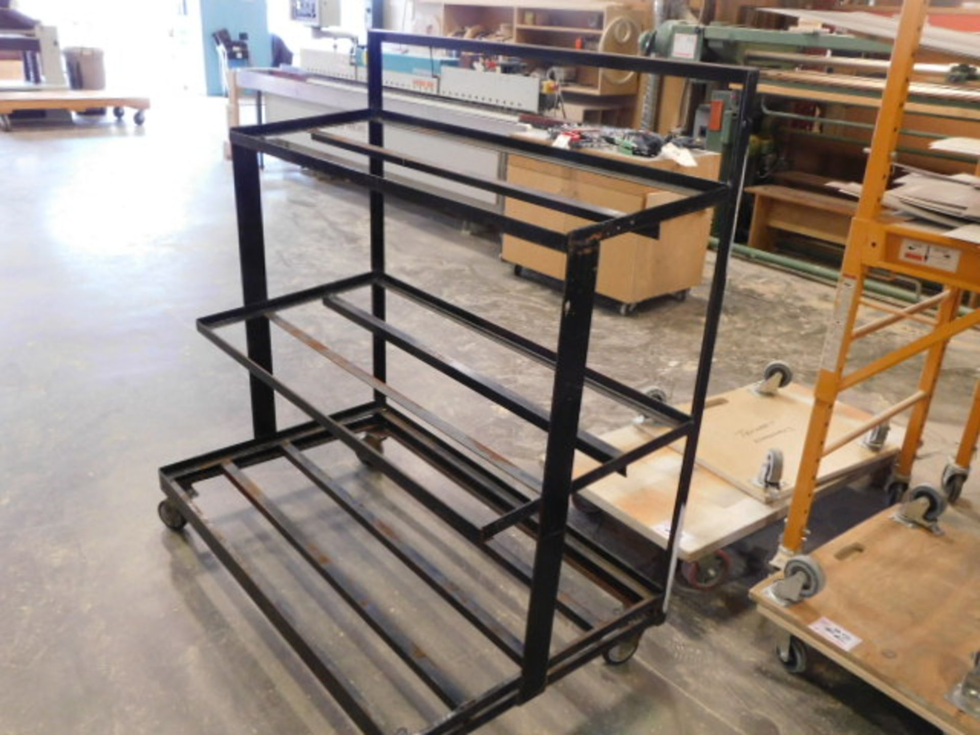 BLACK METAL TIERED RACK ON CASTORS