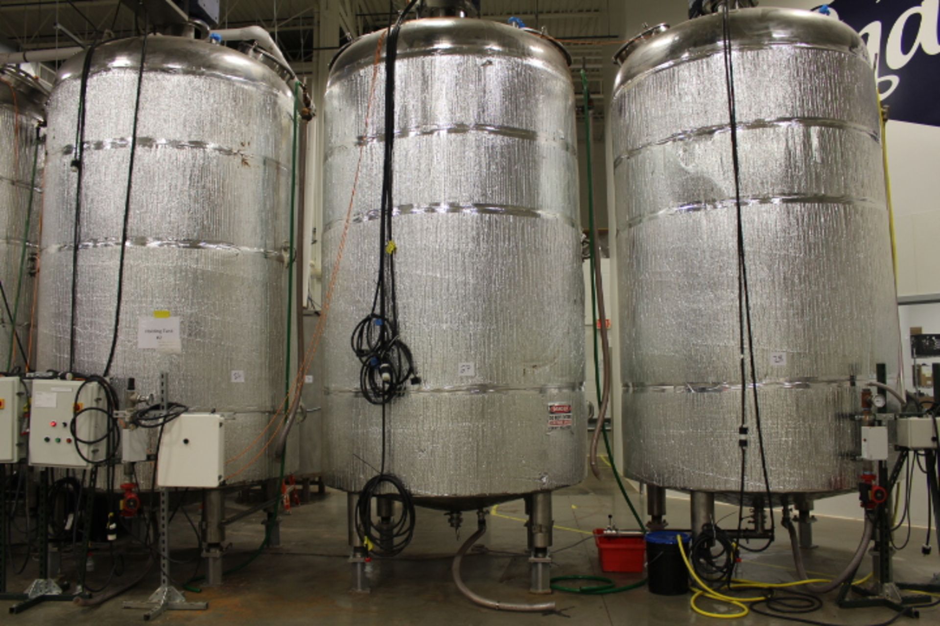 28,000 lb (approx) stainless steel vertical, water jacketed agitated liquid Chocolate Holding Tank