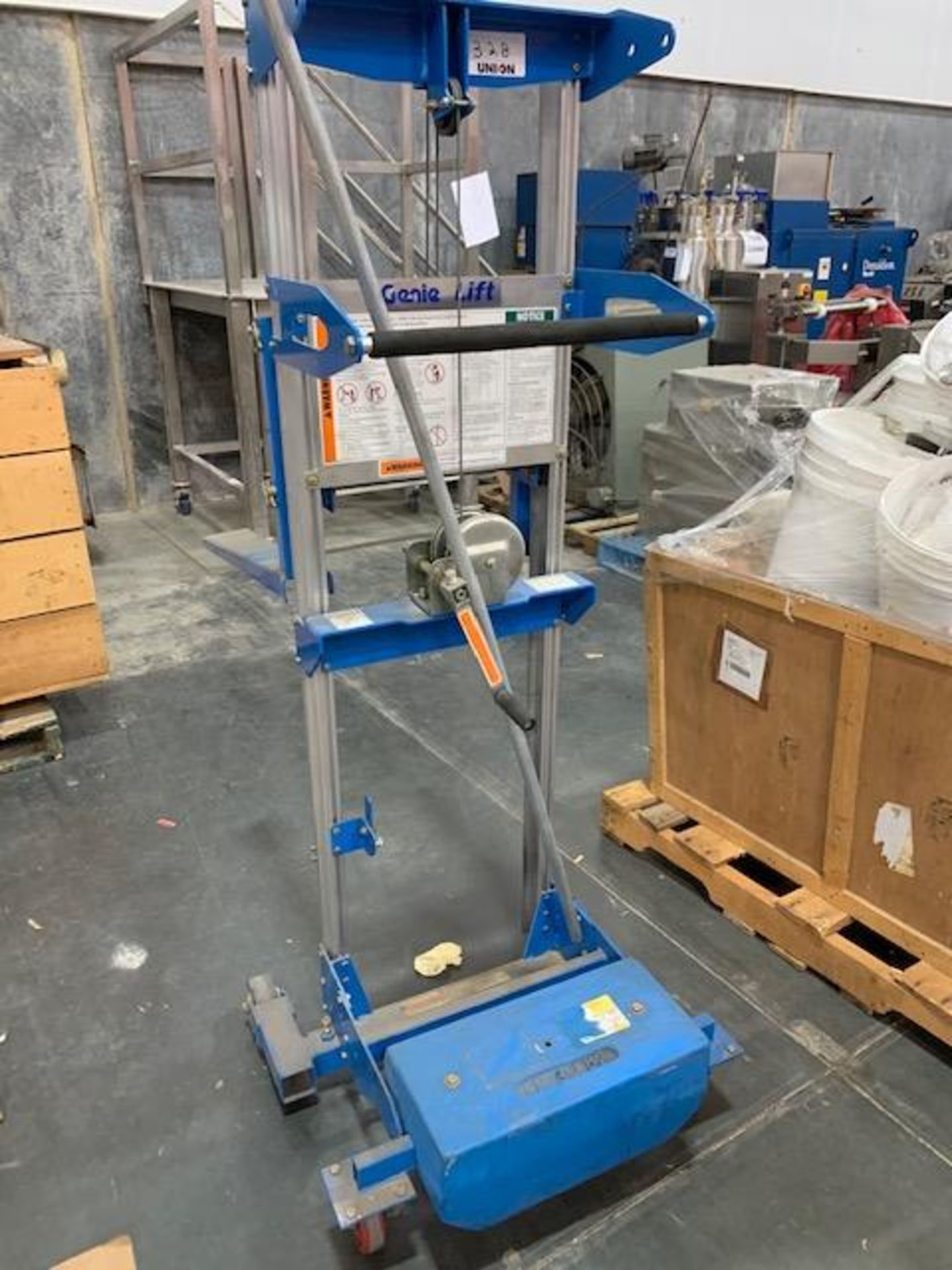 Genie Lift with 500-lb Capacity On Casters. Hand crank.