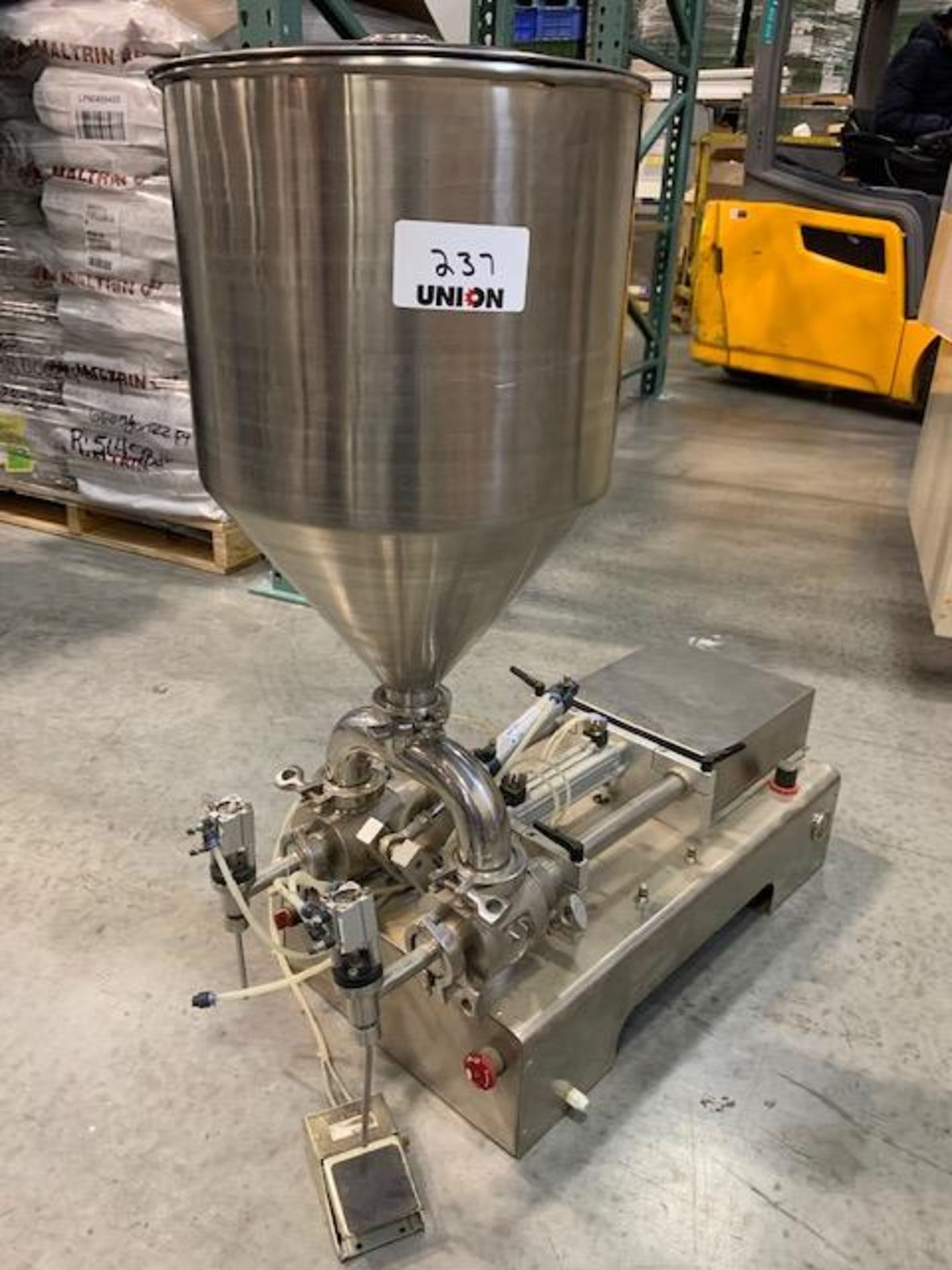 Twin Piston Filler model RGSGP60J with stainless steel hopper 13" diameter x 19" deep, 60 ml pistons