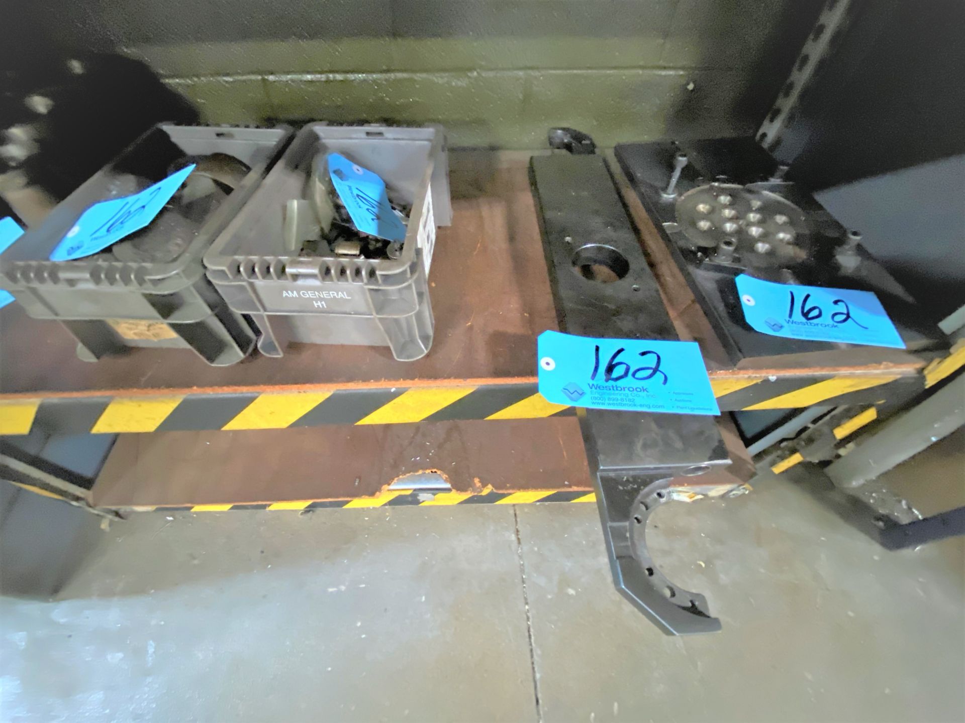 Lot-Misc. Tooling in (2) Totes with (1) Tool Changer Arm, and (1) Fixture Plate