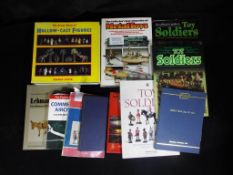 Eleven books and Auction catalogues relating predominantly to diecast, tinplate and hollowcast toys.