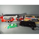 A large, unboxed battery operated American fire engine by New Bright,