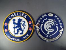 Two cast iron wall plaques advertising football teams This lot must be paid for and removed no