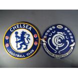 Two cast iron wall plaques advertising football teams This lot must be paid for and removed no