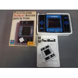 Hand Held Electronic Games - a vintage Entex Taiwan Industries PacMan2 hand held electronic game,