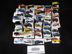 Lledo - In excess of 100 diecast model vehicles by Lledo all in collector boxes.