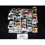 Lledo - In excess of 100 diecast model vehicles by Lledo all in collector boxes.