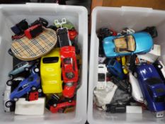 Two boxes containing in excess of 40 diecast cars mixed sizes in playworn condition.