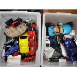 Two boxes containing in excess of 40 diecast cars mixed sizes in playworn condition.