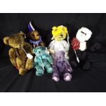 A collection of bears to include Boyds Collection bear, a Cotswold Panda bear with spectacles,