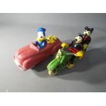 Two cast iron figures depicting Donald Duck and Mickey Mouse [QD&MKM] This lot must be paid for and