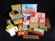 A selection of vintage games to include Chad Valley metal puzzles, Halma domino set,
