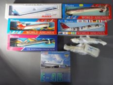 Seven plastic model kits of aeroplanes to include Sky Marks and Wooster and one 1:400 scale diecast